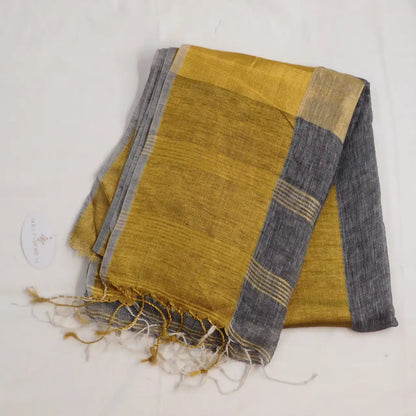 Pure linen saree with golden tall boarder and tassles on pallu